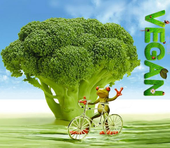 Cartoon frog giving the V for victory sign, set against a backdrop of a broccoli tree with the word 'vegan' down the right hand side. 