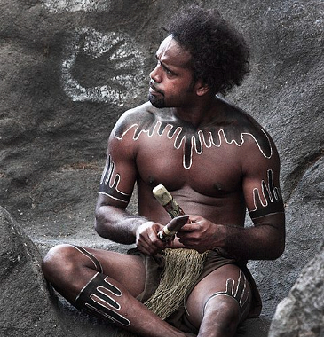 Aboriginal man in traditional body paint.