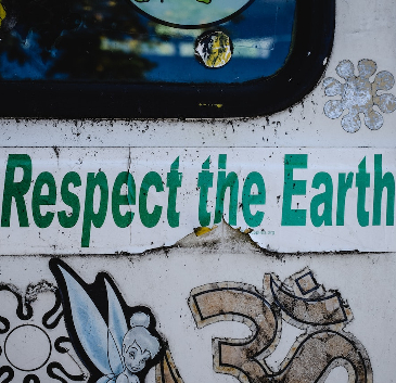 Sticker on the side of a train reading: "Respect the Earth" 