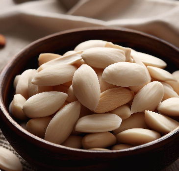 Close up of a bowl of de-skinned almonds. 