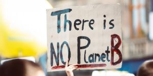 Protester holding up a sign reading 'There is NO planet B'