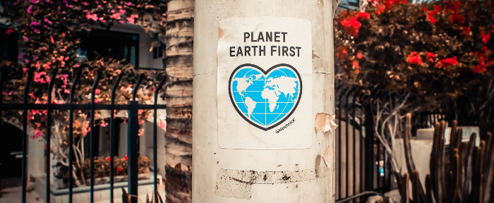 Poster of the Earth in a heart shape with the words "Planet Earth First" 