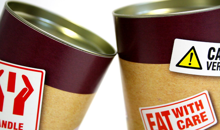 cans of food with a label reading: eat with care 